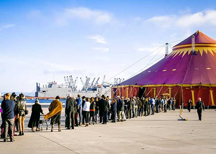 Image of guests lining up to enter Vau de Vire's circus tent, the Tortona Big Top, at Alameda Point